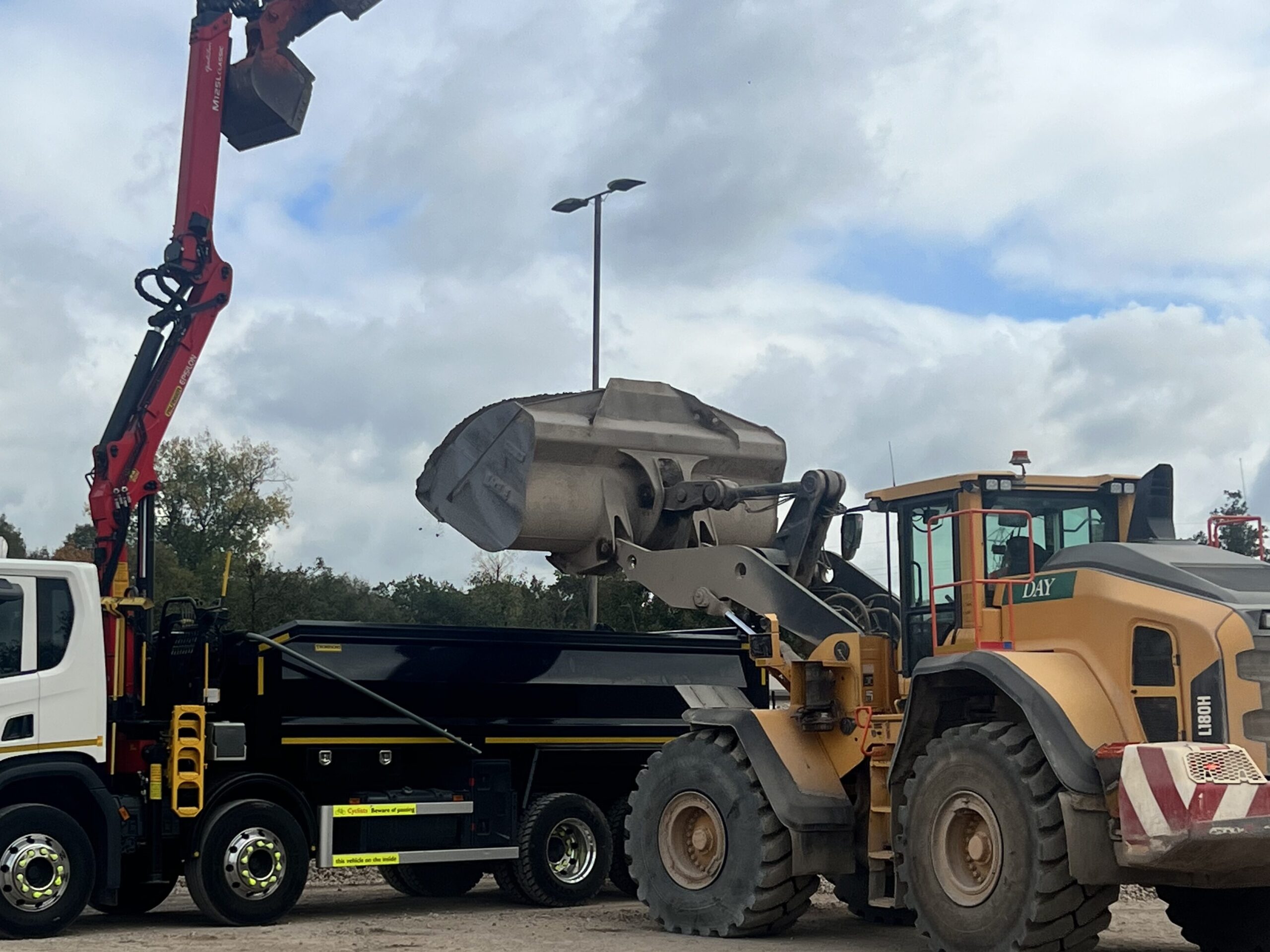 Muck away service, lorry being loaded on site